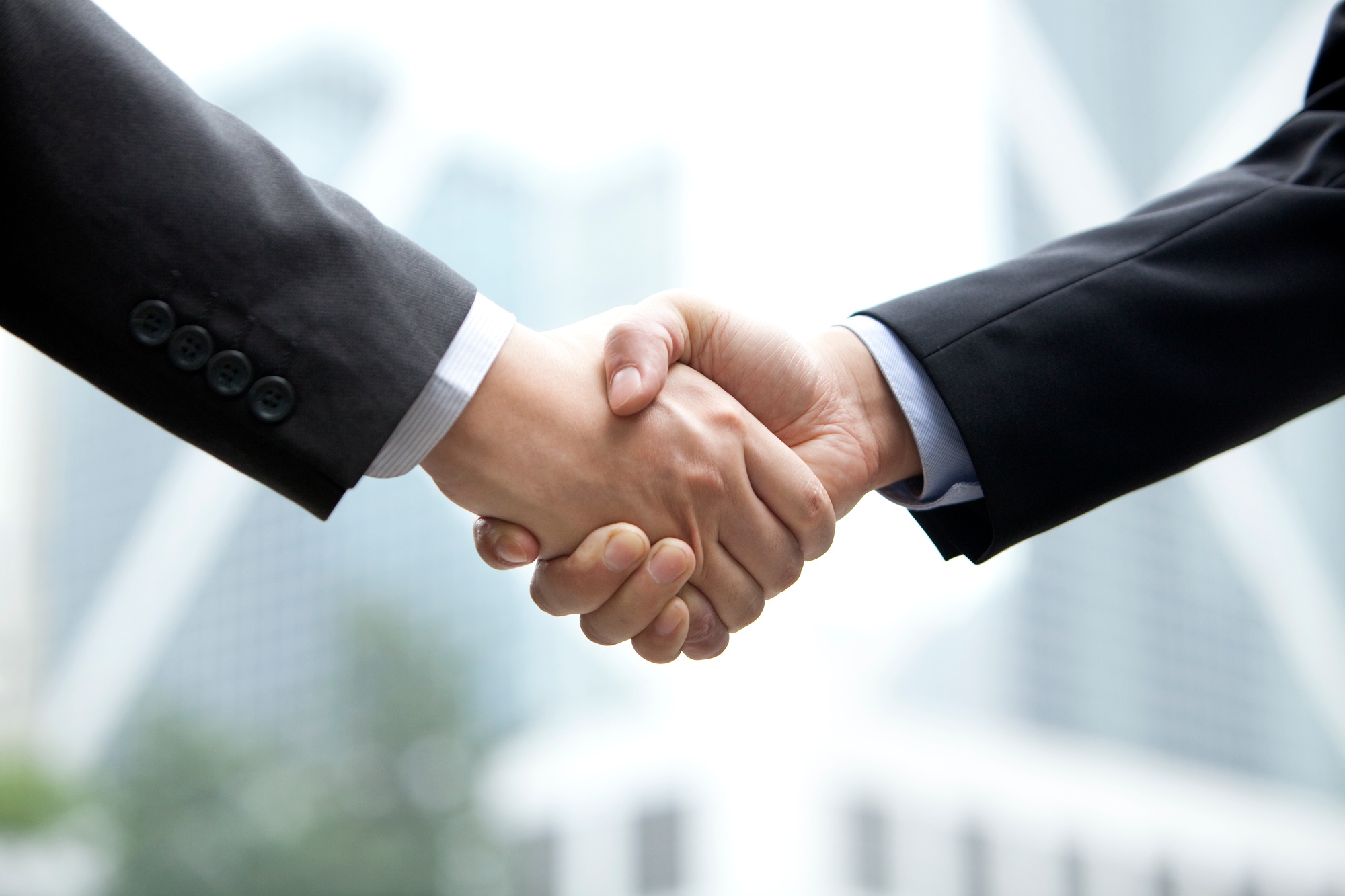 Close up of businessmen shaking hands, Hong Kong